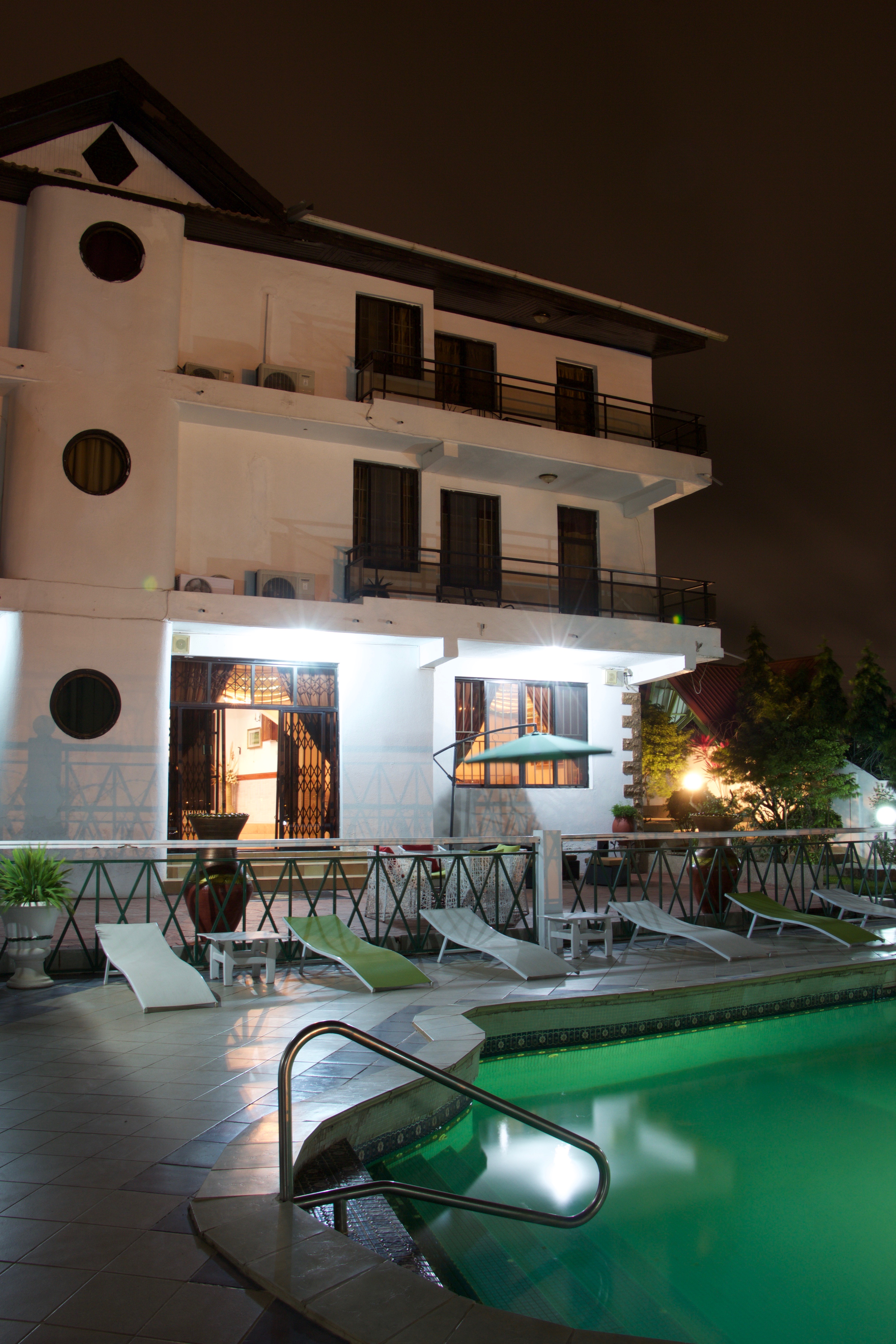 McCarthy Hills pool area at night with illuminated building