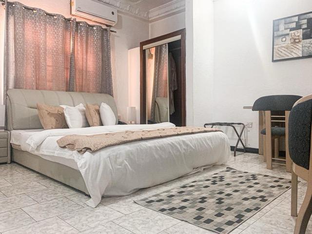 Modern hotel bedroom with comfortable furnishings